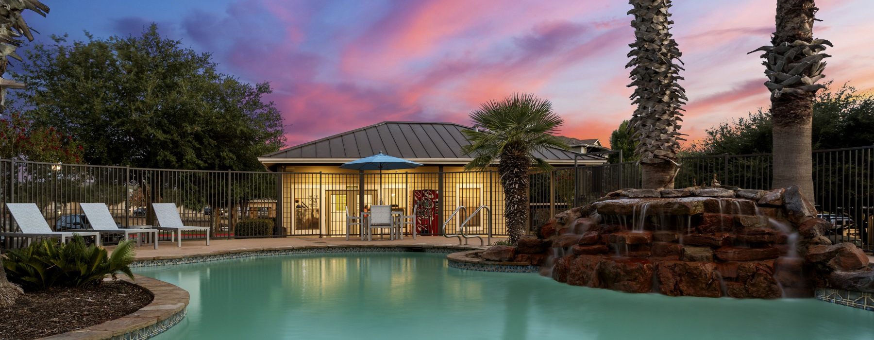 Swimming pool with sundeck at night