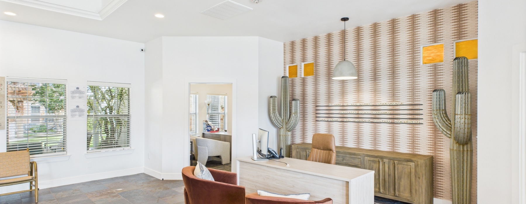 Apartment clubhouse leasing desk with decor