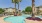 Swimming pool surrounded by palm trees