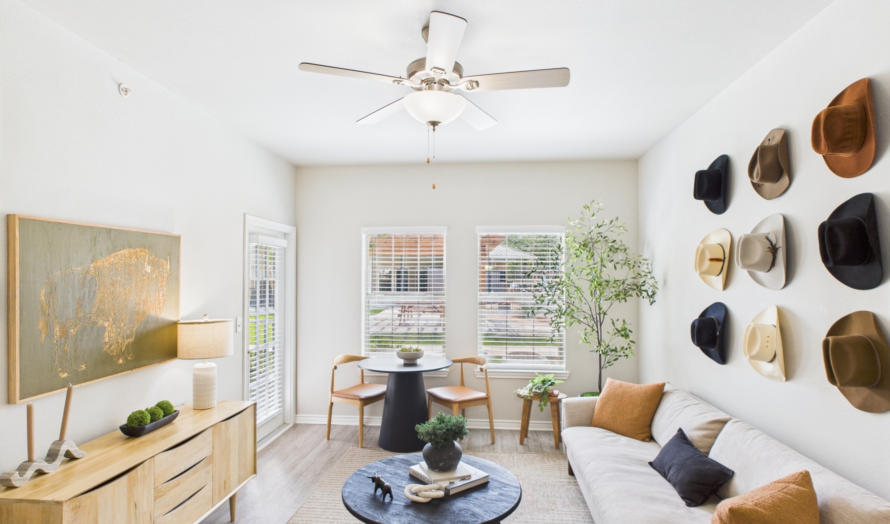 Modern San Marcos apartment near Stokes Park Living room with furniture and hats on wall