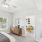 Styled bedroom with view of living room