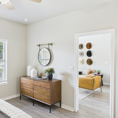 Styled bedroom with view of living room